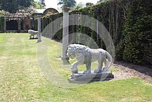 Statues of medici lions and columns at the Italian garden of Hever castle in England