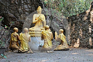 statues of monks and buddhist divinity at mount phou si in luang prabang (laos) photo
