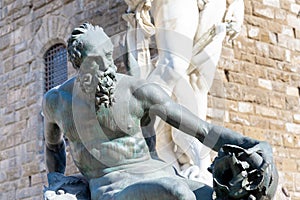 statues of the Neptune fountain in Florence, Italy