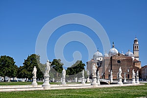 Statues and park and Basilica de Santa Justina church in Prato della Valle in the city of Padua photo