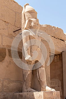 The statues of Pharaoh Ramses III guarding the precinct of the temple of Karnak, Luxor, Egypt