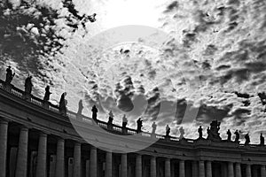 Statues of religious saints on the colonnades of St. Peter`s Basilica at St. Peter`s Square in Vatican City, Rome, Italy