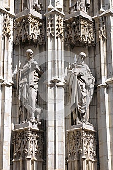 Statues of saints carved in stone, detail of exterior in the Cathedral of Seville, Andalusia, Spain.