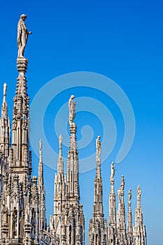 Statues on the spikes of the rooftop of the cathedral of Milan, Lombardy, Italy