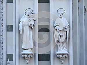 Statues of St. Anthony of Padua and St. Patrick on the facade of Sacro Cuore del Suffragio church in Rome