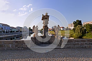 Statues on stone bridge