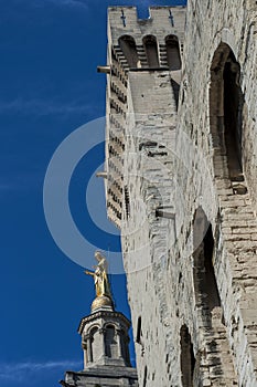 Statues and tower at the Palace of the Popes in Avignon, France