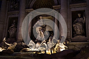 Statues of the Trevi Fountain at night in Rome