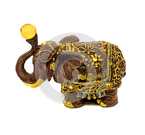 Statuette of brown elephant with yellow sapphire isolated on a white background