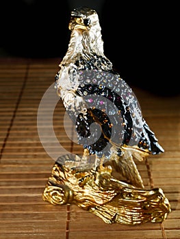 Statuette of an eagle on the background