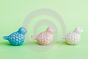 Statuettes of White, Blue and Pink Birds