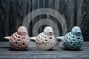 Statuettes of White, Blue and Pink Birds