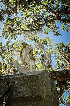 Stature guards the Entrance to the Bonaventure Cemetery in Savannah Georgia photo