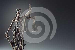Statute of Justice. Bronze statue Lady Justice holding scales an photo