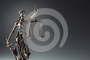 Statute of Justice. Bronze statue Lady Justice holding scales an