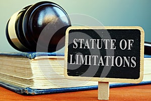 Statute of limitations sign, book and gavel