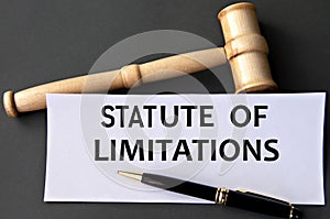 STATUTE OF LIMITATIONS - words on white paper on dark background with judge\'s gavel