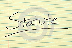Statute On A Yellow Legal Pad photo