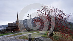 Stavkirke or stave church of Lom in autumn in Norway