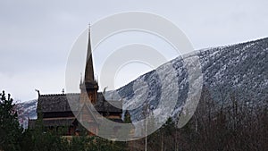 Stavkirke or stave church of Lom in autumn in Norway