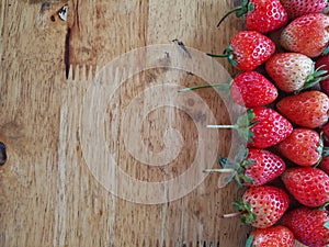 Stawberries on wood background with copy space