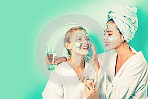 Stay beautiful. Skin care for all ages. Women having fun cucumber skin mask. Relax concept. Beauty begins from inside