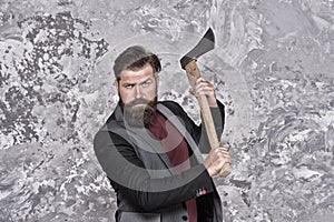 Stay brutal. Brutal hipster hold axe. Bearded man with brutal look. Retro barbershop. Shaving and grooming shop. Hair
