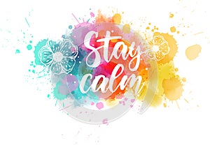 Stay calm lettering on abstract paint splash photo