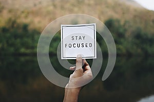 Stay focused text in nature inspirational motivation and advice concept photo