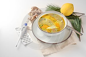 Stay healthy in the cold and flu season with chicken soup, ginger and lemon as home remedies, fiber thermometer and tablets for