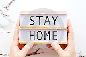 Stay home campaign for coronavirus prevention, Word on wooden box for the preventative measure to protect the infection of corona