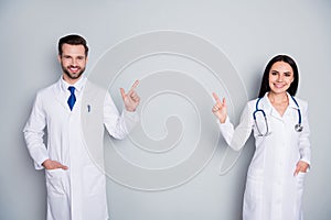 Stay home concept. Photo of family doc lady guy assistant virology clinic direct finger empty space show banner poster