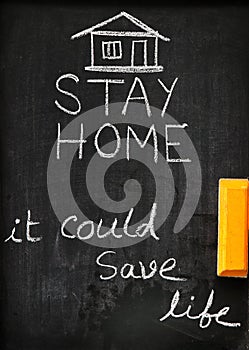 `Stay home it could save life` concept written on blackboard.