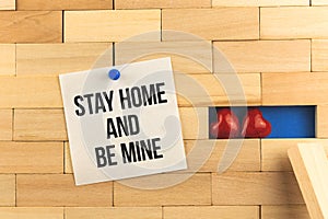 Stay home and happy valentine`s day concept image with text inscription, new 2021 year, sitting home, pinned notepad paper with