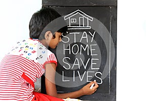 `Stay home save lives` concept written on blackboard.