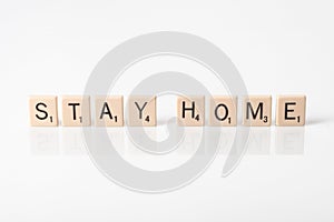 Stay Home spelled with tiles