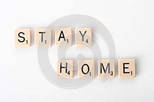 Stay Home spelled with tiles