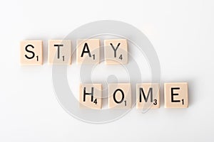 Stay Home spelled with tiles photo