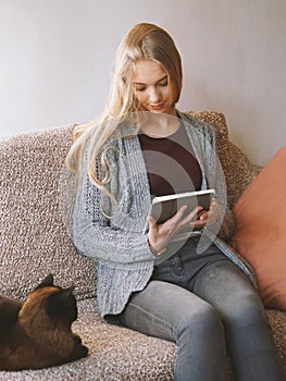 Stay at home teenage girl reading e-book