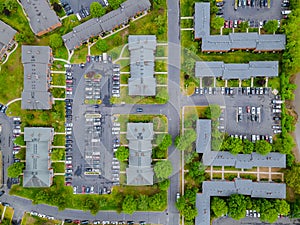 Stay Home to Coronavirus, COVID-19 aerial parking lot of many cars small Town USA hometown suburban area