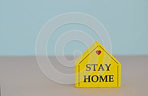 Stay Home written on cube wooden block. Stay home concept Corona virus, covid-19 quarantine concept