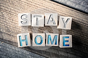 Stay Home Written On Wooden Blocks On A Board photo