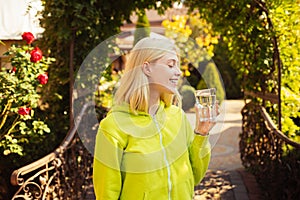 Stay hydrated. Resort with mineral water sources. Enjoy every sip of crystal clear water in blooming garden. Girl drink