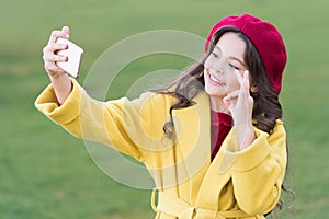 Stay in the loop. Happy small blogger keep video blog or vlog. Cute girl show ok gesture for blog photo. Little child