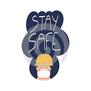 Stay safe handwritten phrase with worker in safety face mask photo