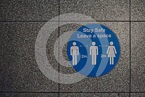 Stay safe leave a space 2 metres  social distancing sign in London, UK photo
