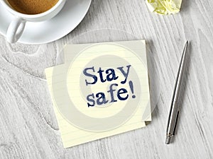 Stay safe message on post-it