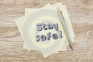 Stay safe message on post-it