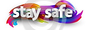 Stay safe sign over brush strokes background photo