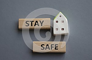 Stay Safe symbol. Concept word Stay Safe on wooden blocks. Beautiful grey background. Business and Stay Safe concept. Copy space